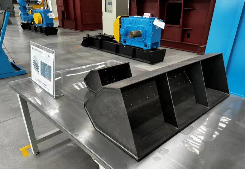 Automated welding solution for building material machinery hoppers