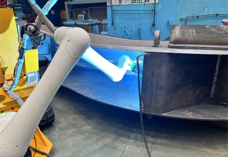 AGR cobot welding system performing on-site boom welding